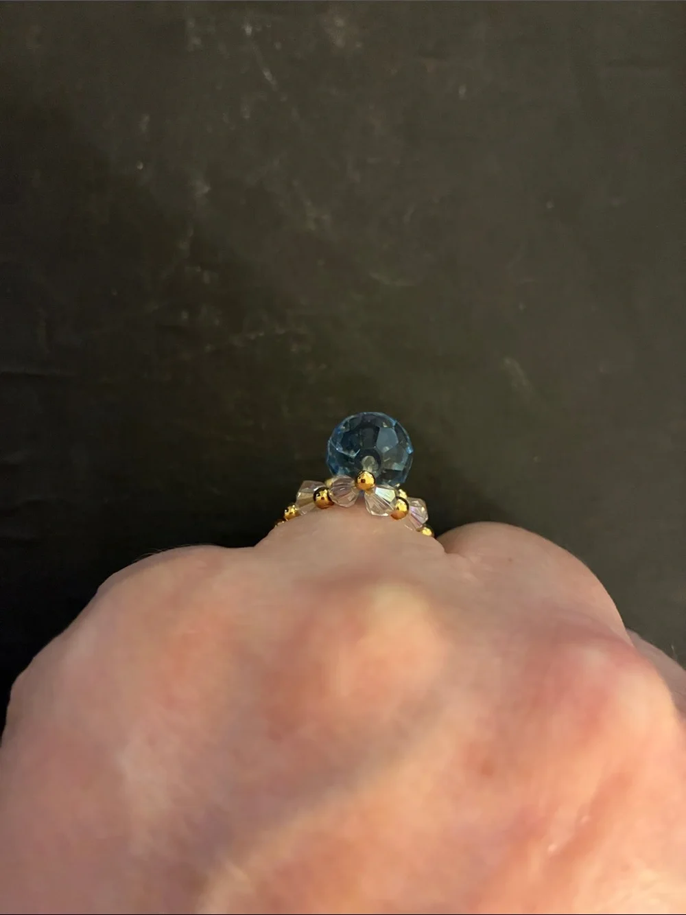 Gold-Tone Stretch Beads.Ring with Light Blue Faceted Stone and Crystal Accents.